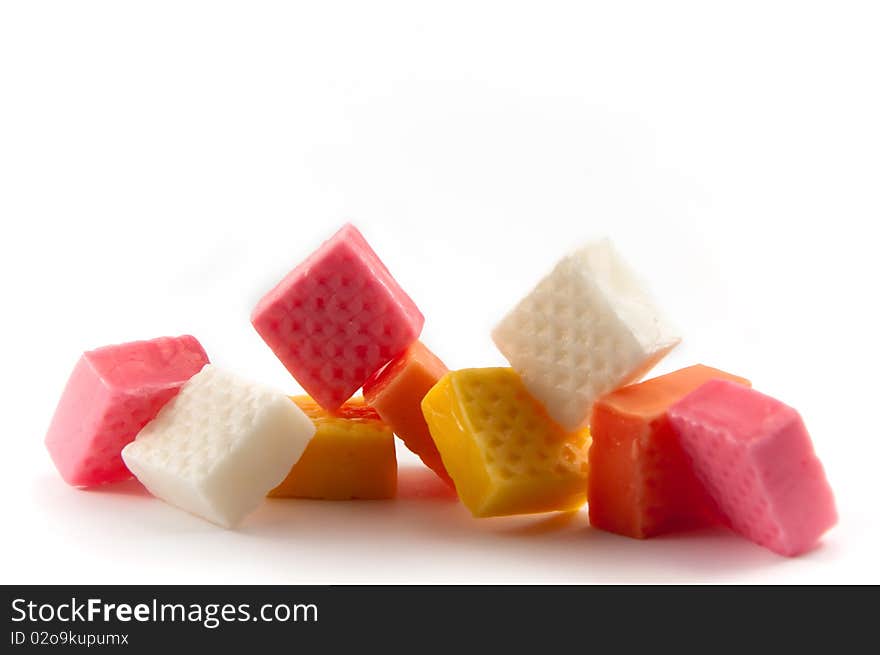 Different colored chewy сandies are depicted on a white background. Different colored chewy сandies are depicted on a white background