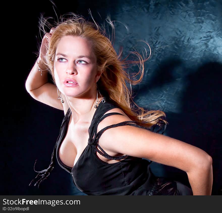 blondie woman with spreading hair dancing