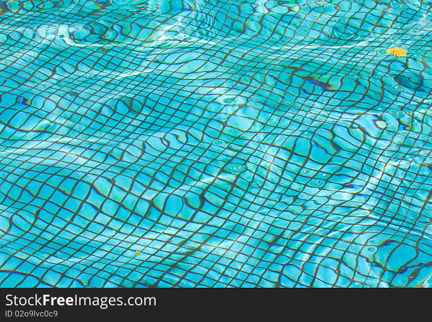 Waterpool bottom texture under water (abstract background)