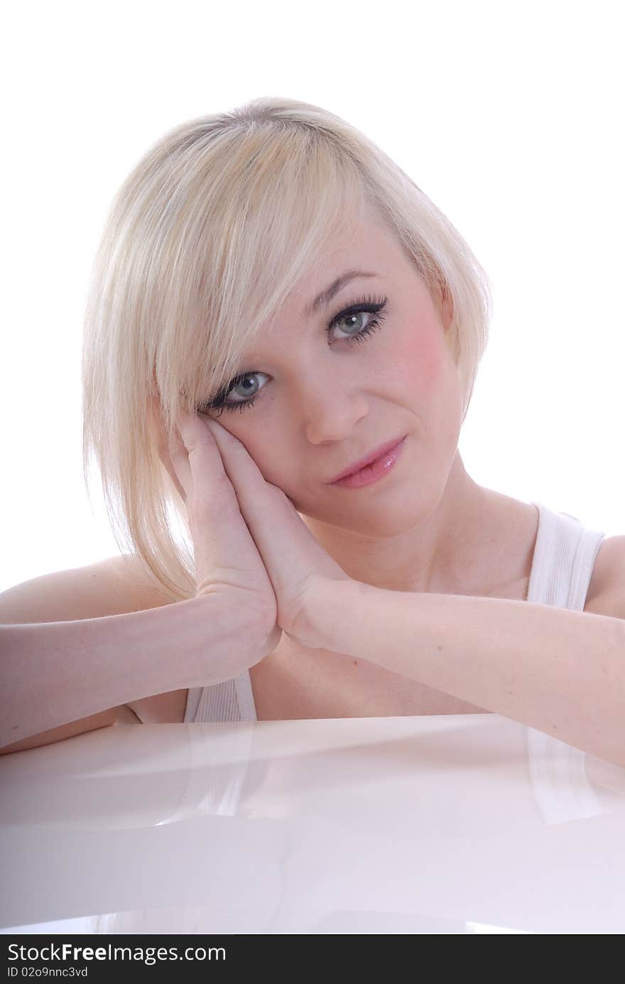 Photograph showing beautiful young blond woman in high key portrait isolated against white. Photograph showing beautiful young blond woman in high key portrait isolated against white