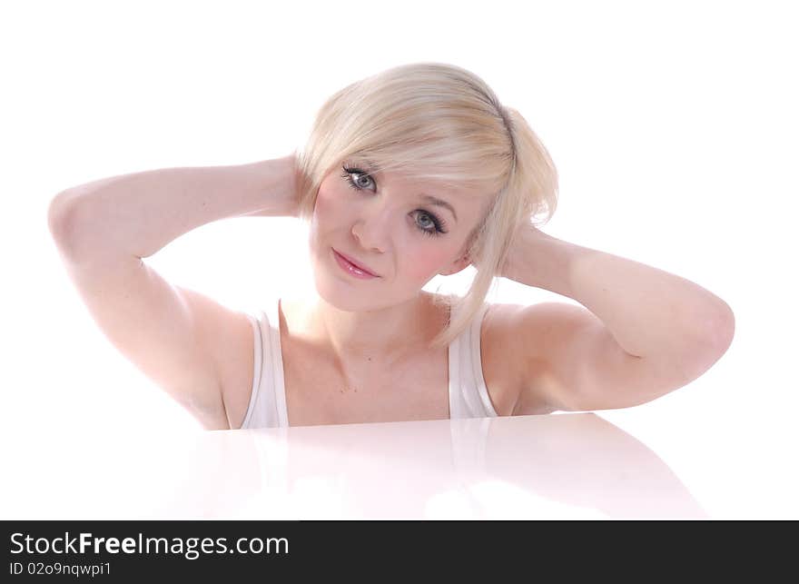 Photograph showing beautiful young blond woman in high key portrait isolated against white. Photograph showing beautiful young blond woman in high key portrait isolated against white