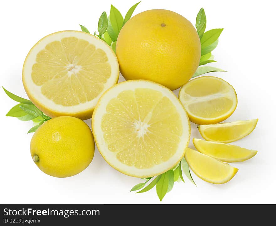 Group of yellow lemons and grapefruits with green leafs isolated on white with clipping path. Group of yellow lemons and grapefruits with green leafs isolated on white with clipping path