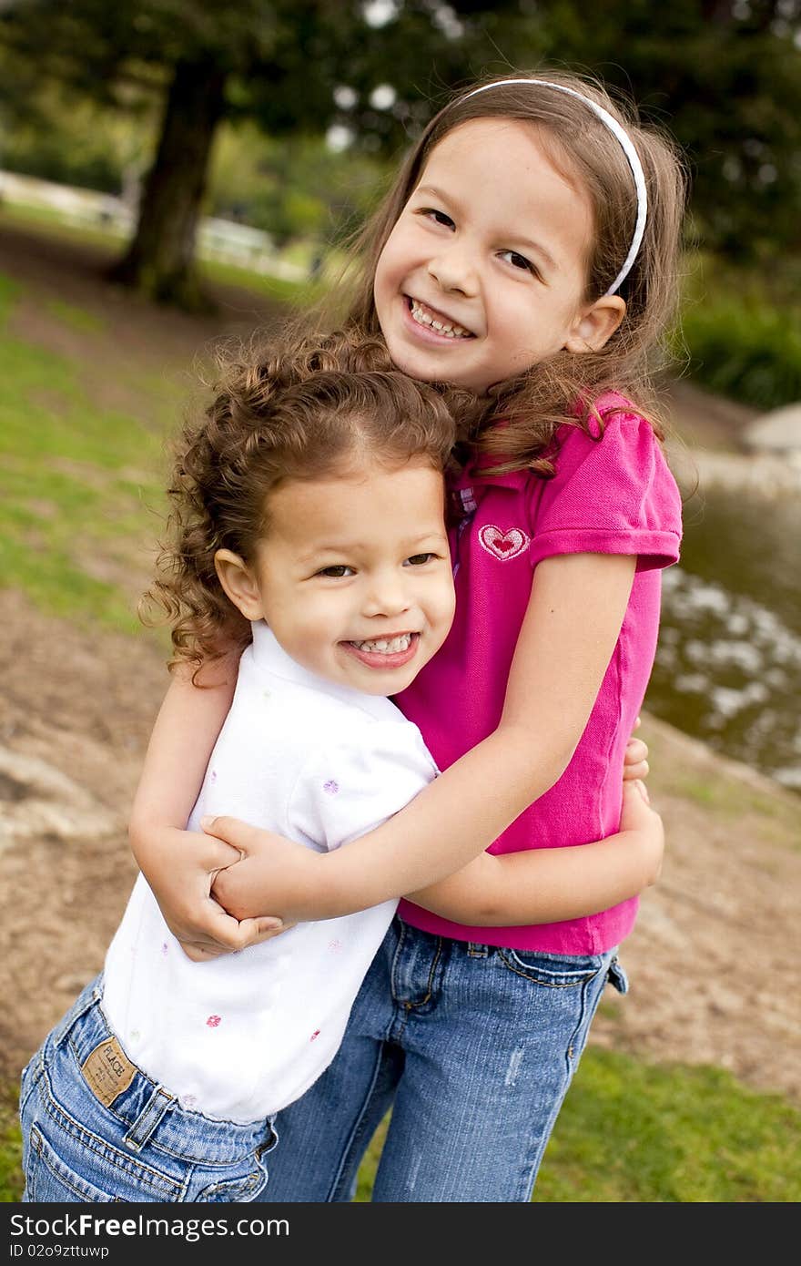 Cute little sisters playing outside