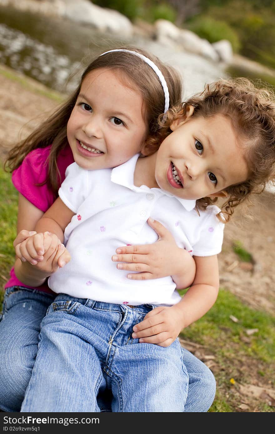 Cute little sisters playing outside