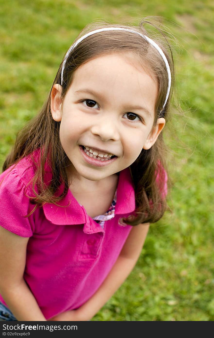 Portrait of a cute little girl outside