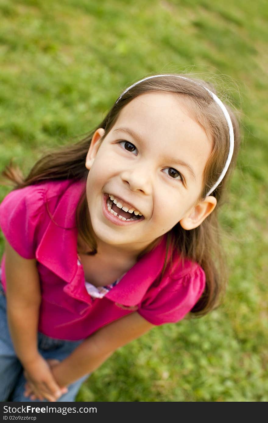 Portrait of a cute little girl outside