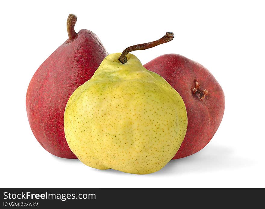 One yellow and two red pears over white background. One yellow and two red pears over white background