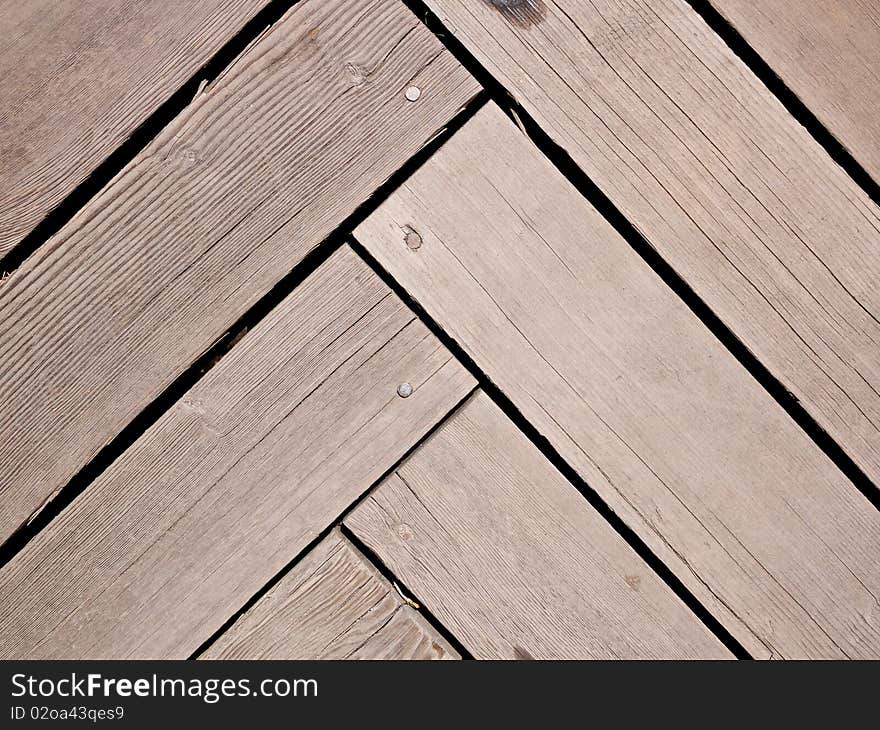 Herringbone or parquet pattern in wood planks or decking. Herringbone or parquet pattern in wood planks or decking