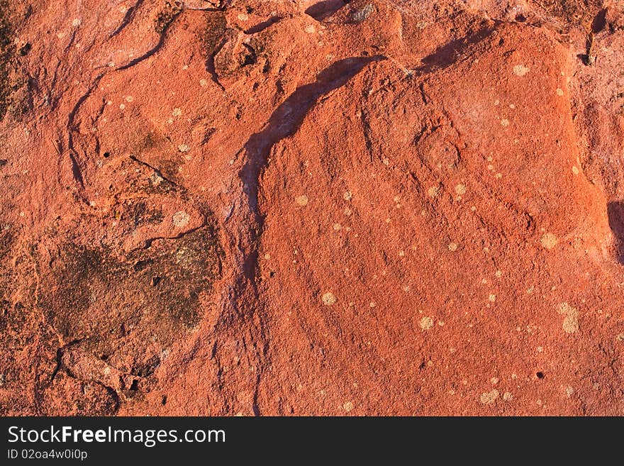 Orange stone texture pattern in daylight. Orange stone texture pattern in daylight