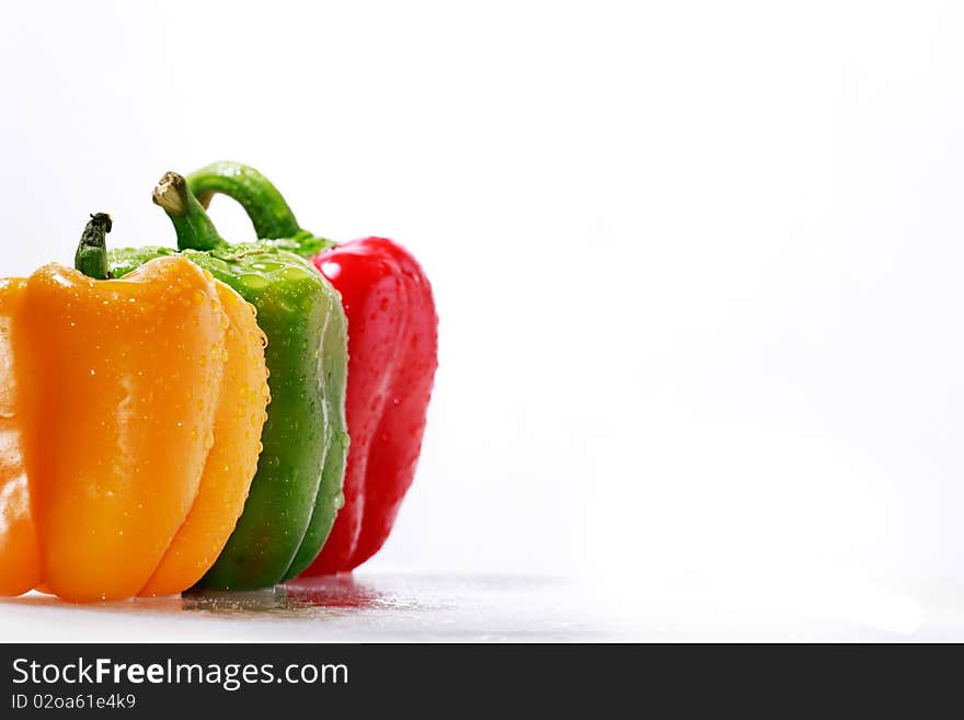 A set of assorted red, green and orange bell peppers. A set of assorted red, green and orange bell peppers