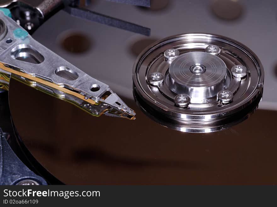 Inside view of a computer hard disc drive closeup. Inside view of a computer hard disc drive closeup