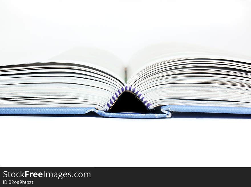 Close up of open text book isolated. Close up of open text book isolated