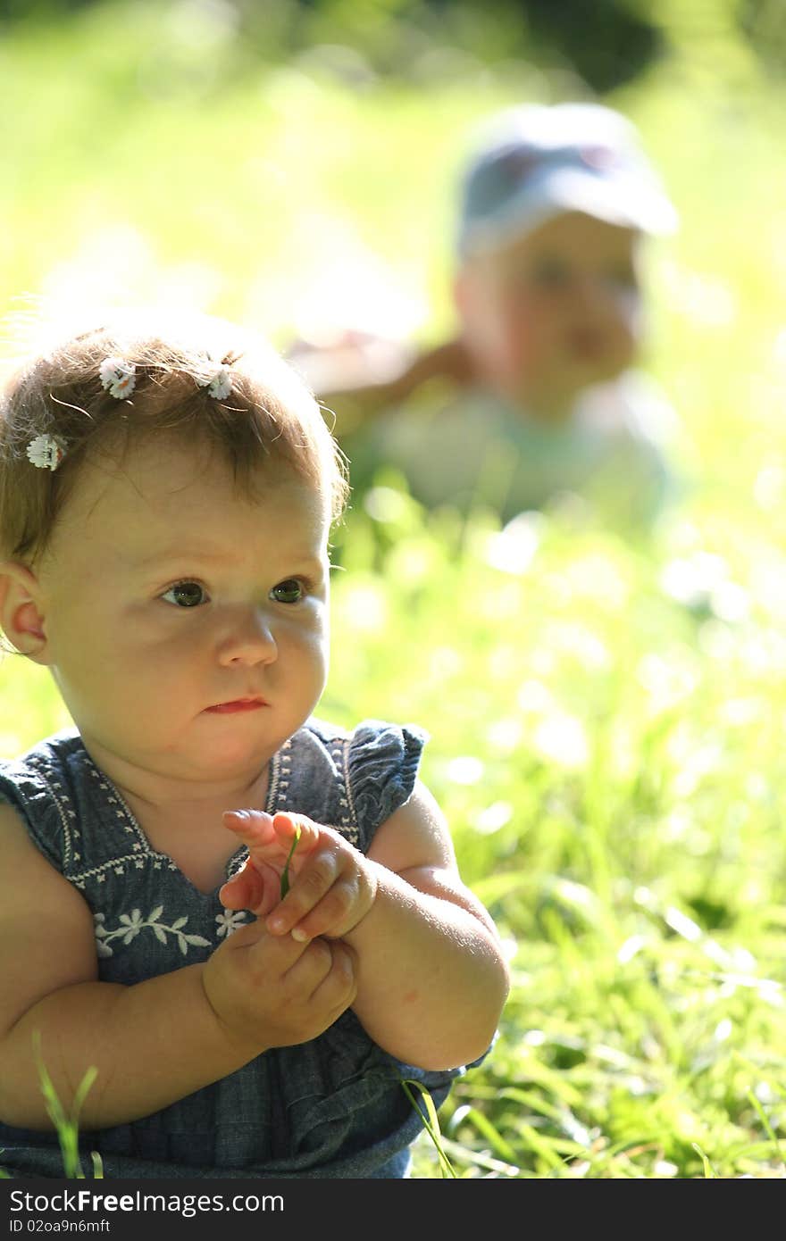 The girl on a green grass