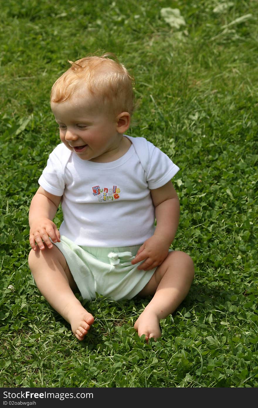 Small little boy looks happy in the nature. Small little boy looks happy in the nature