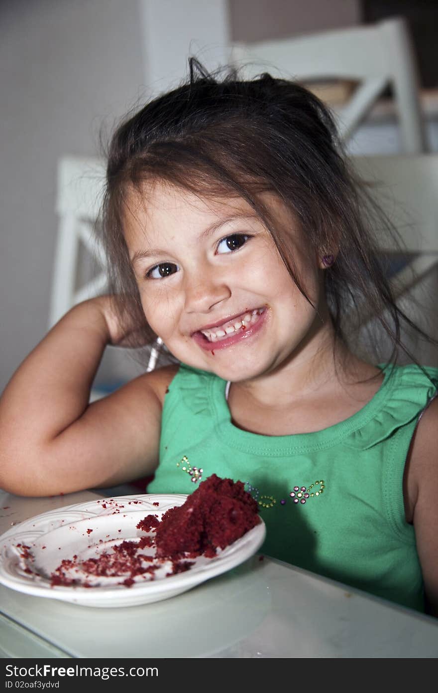 Little girl enjoying some chocolate cake. Little girl enjoying some chocolate cake