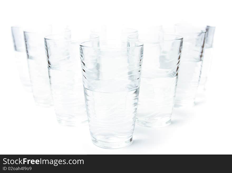 Photo of too many glasses of water half full. Photo of too many glasses of water half full