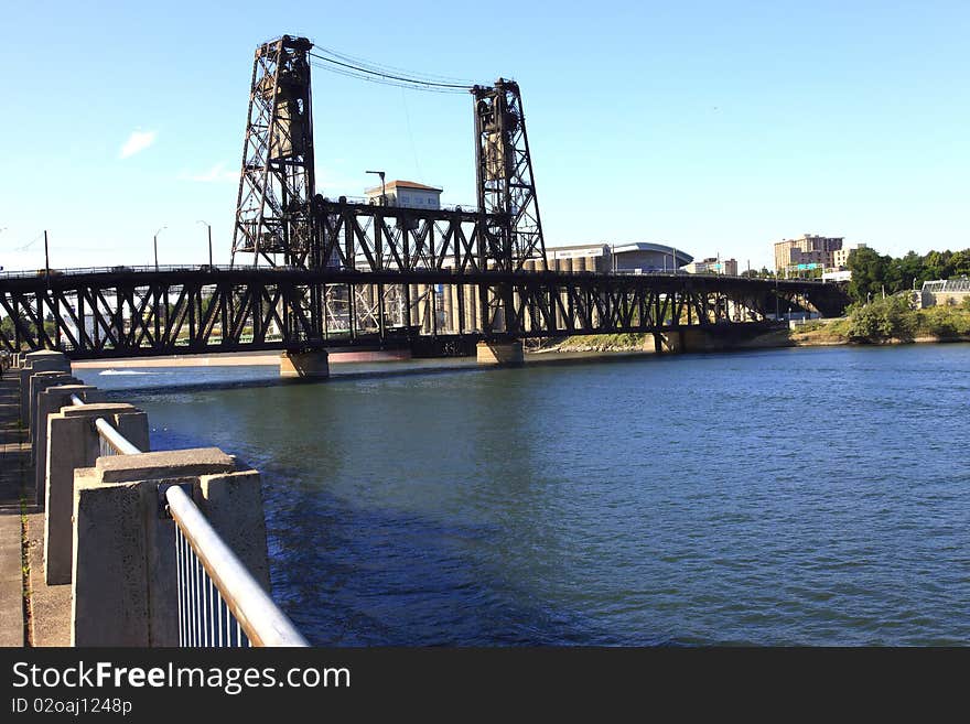 The Steel bridge seen from the promenade and park in Portland OR. The Steel bridge seen from the promenade and park in Portland OR.