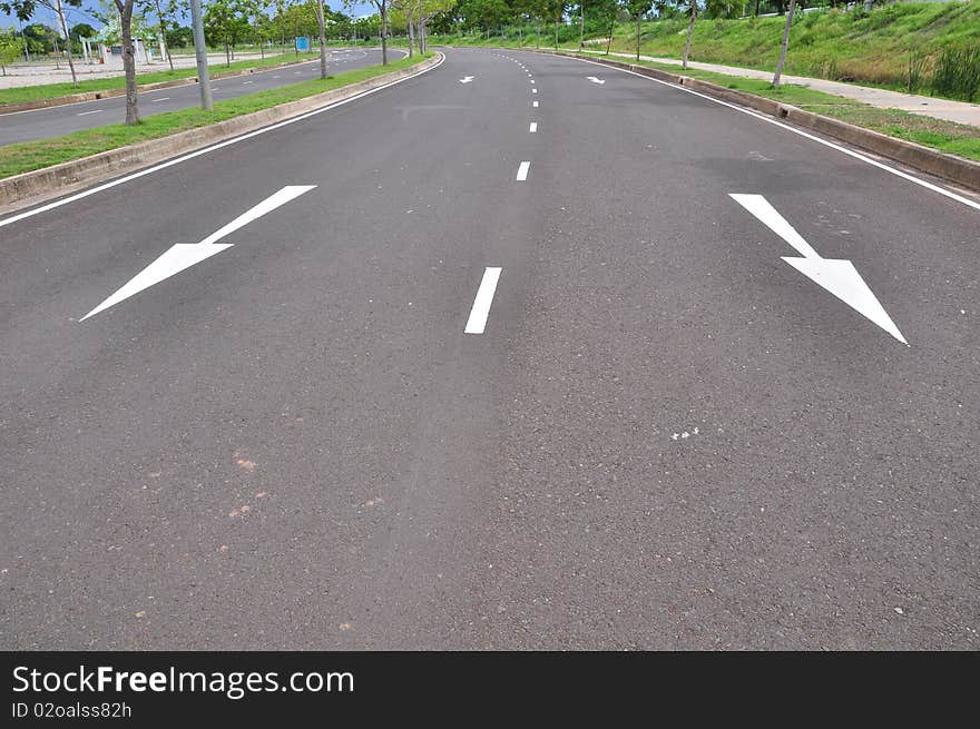 Arrow traffic symbol in asphalt road. Arrow traffic symbol in asphalt road