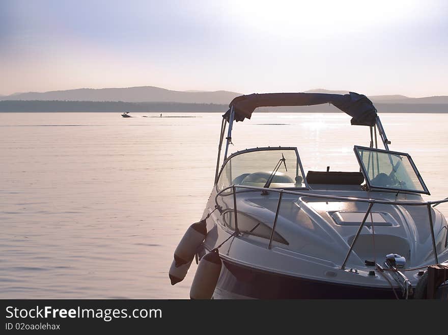 Boat on the lake with the sunset in the background