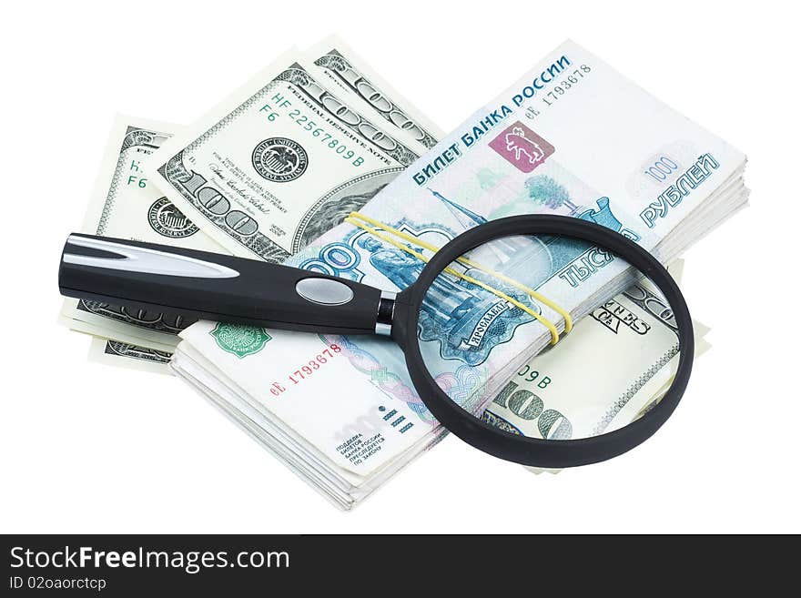 Dollars and roubles and magnifying glass on white background