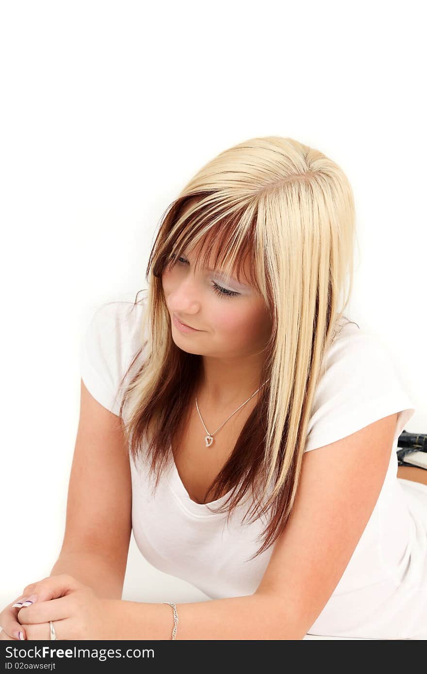 Portrait of young blonde woman relaxing, studio shot. Portrait of young blonde woman relaxing, studio shot