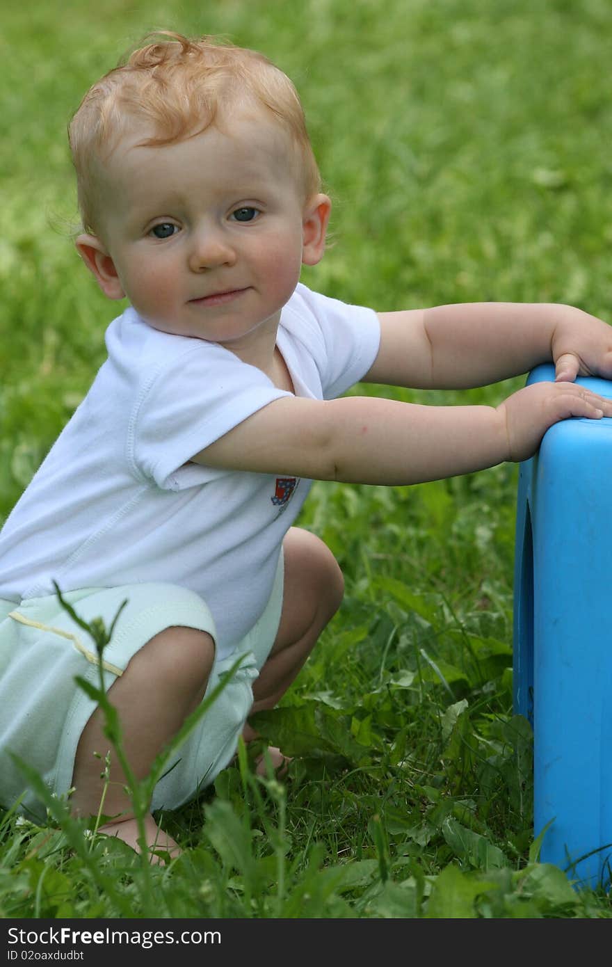 Small little boy looks happy in the nature. Small little boy looks happy in the nature