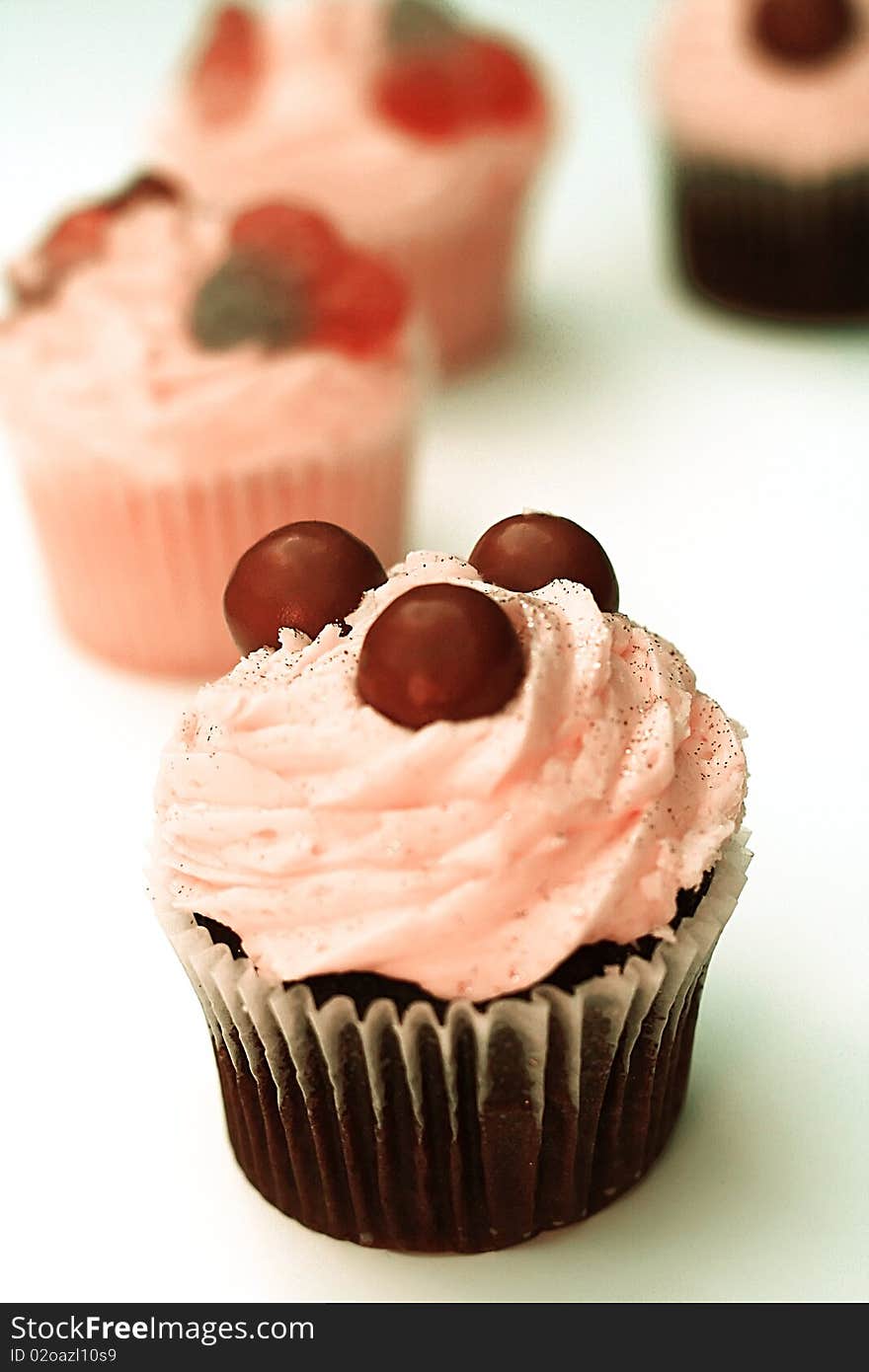 Cupcakes with Pink Frosting on White