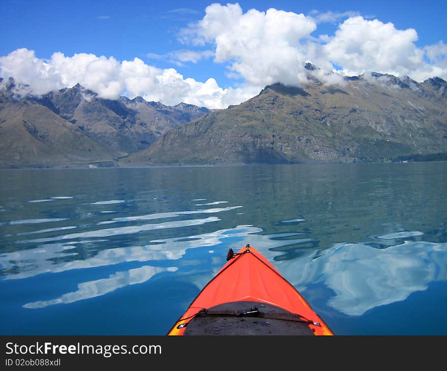 Kayaking accross Lake Wakatipu on a clean crisp day, New Zealand. Kayaking accross Lake Wakatipu on a clean crisp day, New Zealand.