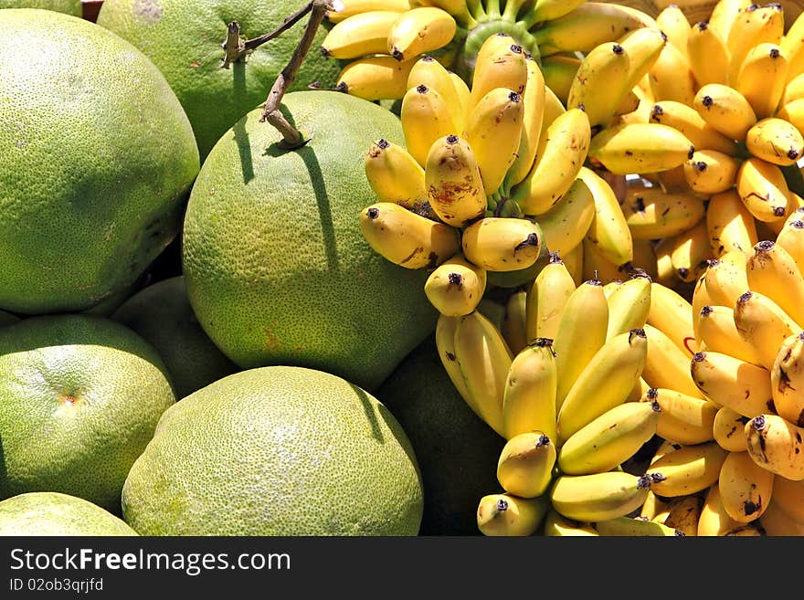 Assortment of fresh fruits consisting of
bananas and shaddock