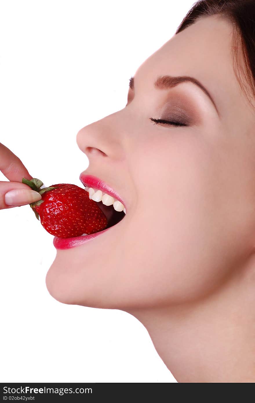 Beautiful woman biting strawberry