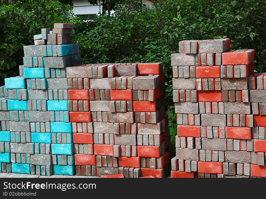 Stacks of colorful brick in construction site