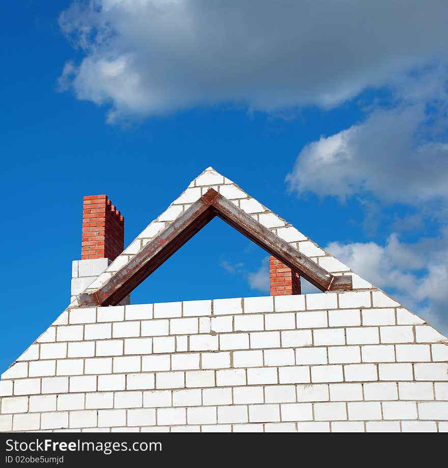 Unfinished roof on background of blue sky