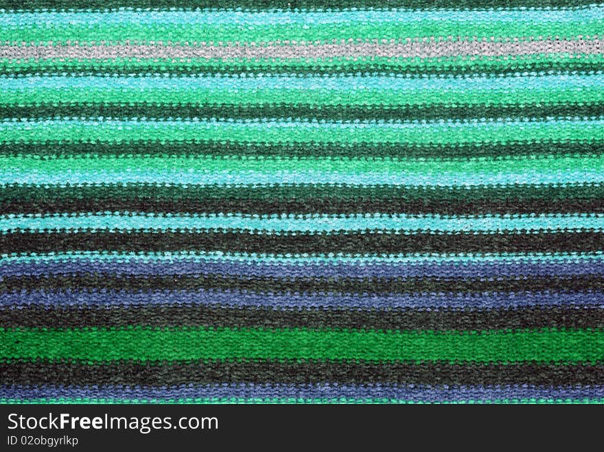 Nice closeup knitting texture with multicolored stripes