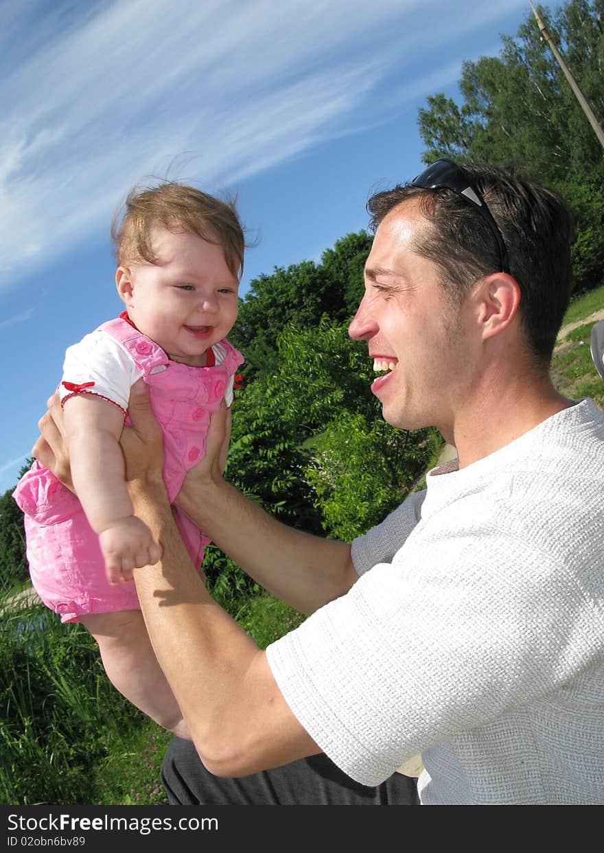 The daddy with the daughter goes for a walk. The daddy with the daughter goes for a walk