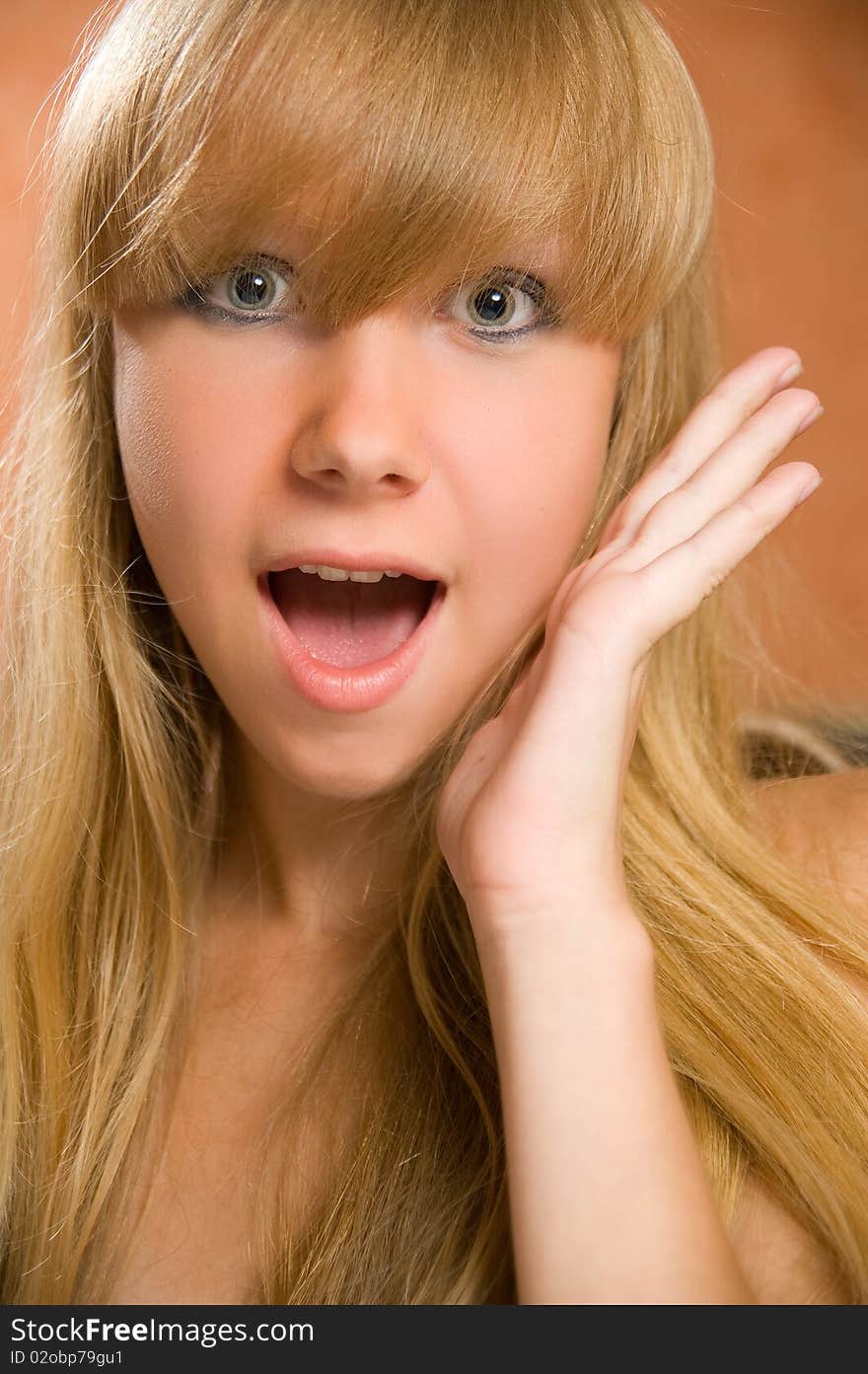 Headshot of a excited young teenage model with a surprised expression. Headshot of a excited young teenage model with a surprised expression.