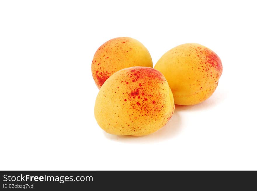 Ripe apricots are isolated on a white background. Ripe apricots are isolated on a white background