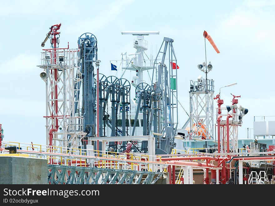 Detailed photo of oil terminal at industrial harbour.