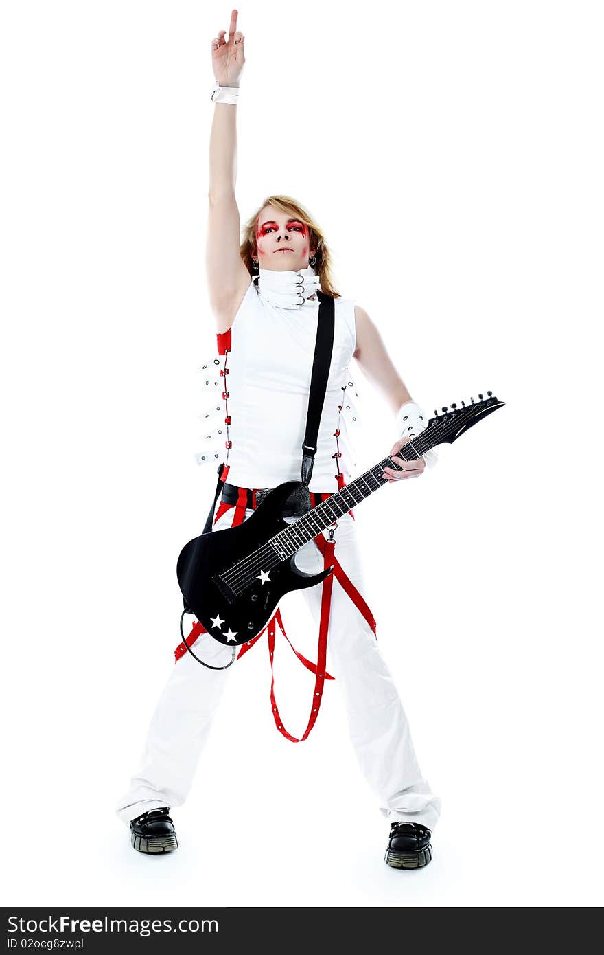 Rock musician is playing electrical guitar. Shot in a studio. Rock musician is playing electrical guitar. Shot in a studio.