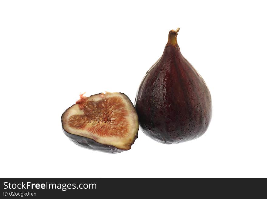 One full fig and half fig on white. One full fig and half fig on white