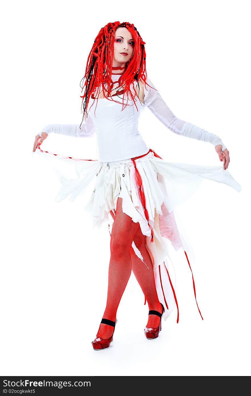 Trendy girl with red dreadlocks is dancing. Shot in a studio. Trendy girl with red dreadlocks is dancing. Shot in a studio.