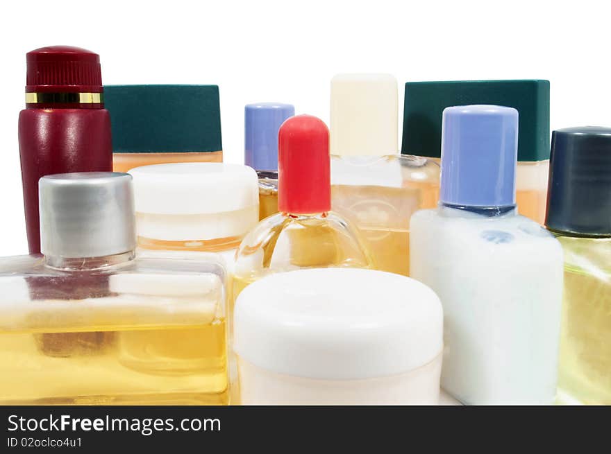 Small shampoo plastic bottles close up on white. Small shampoo plastic bottles close up on white