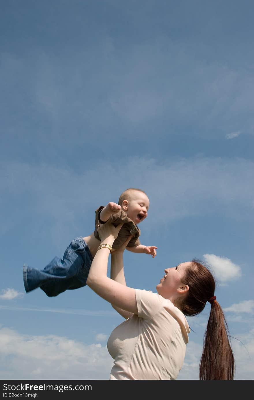 Mother playing with baby