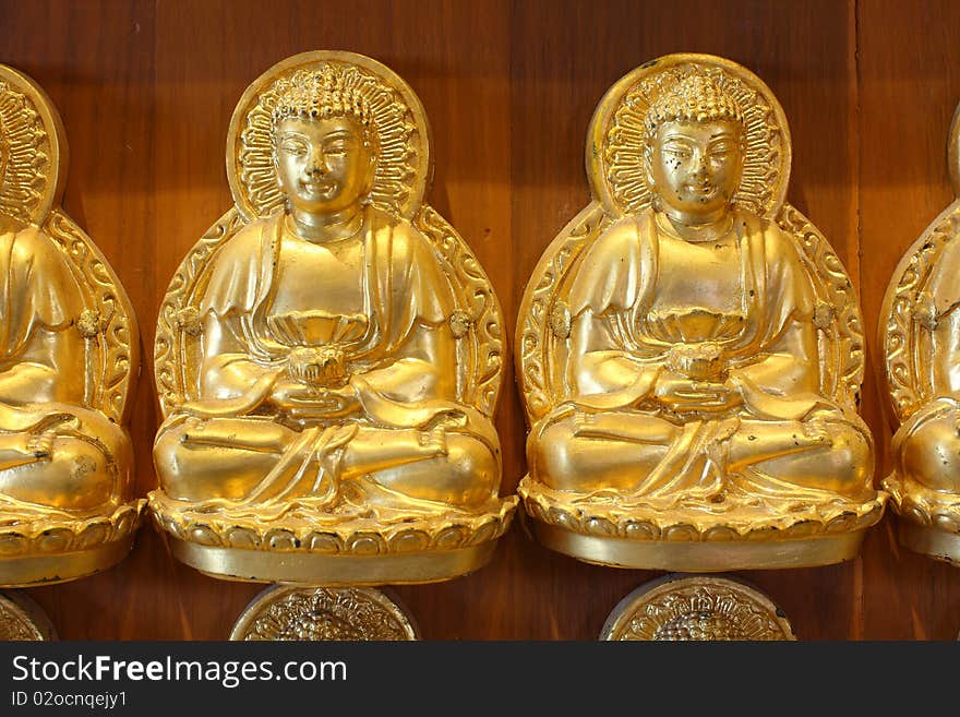 Gold buddha doll