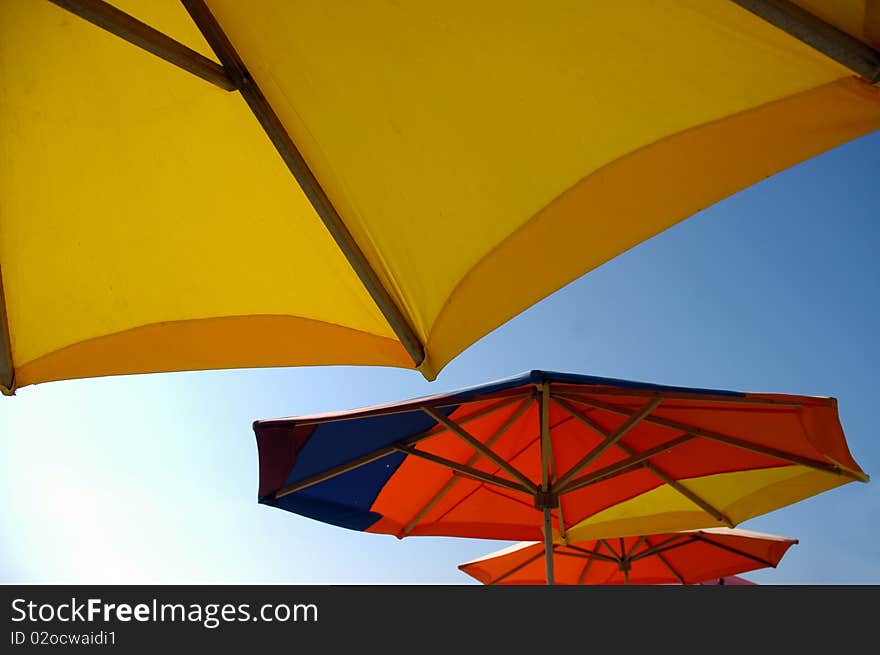 Colorful beach umbrellas against sunlight. Colorful beach umbrellas against sunlight