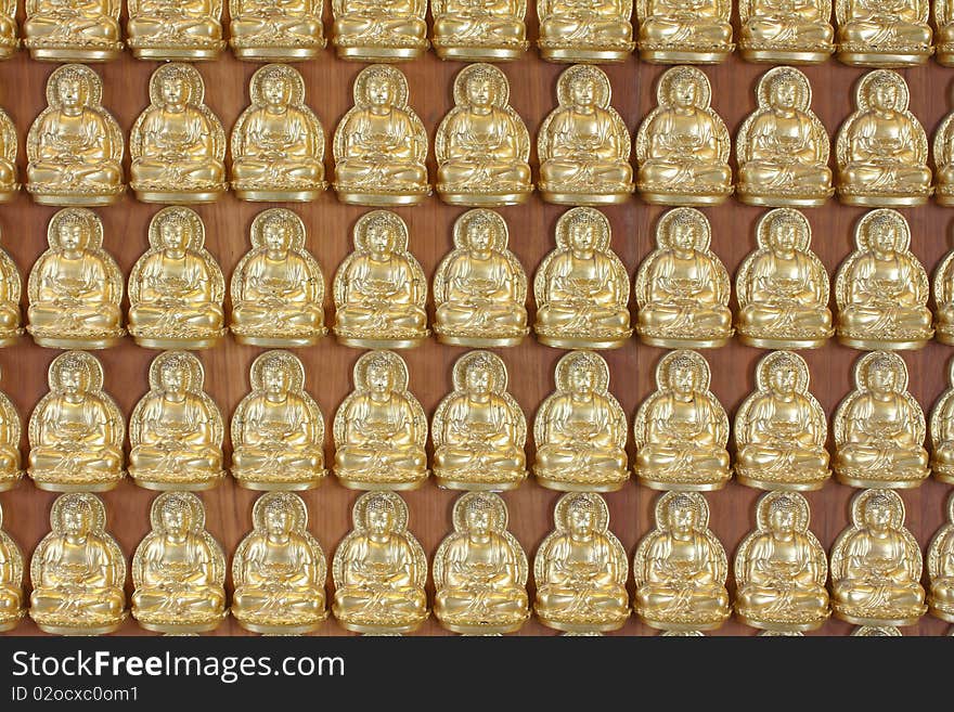 Pattern of gold buddha doll