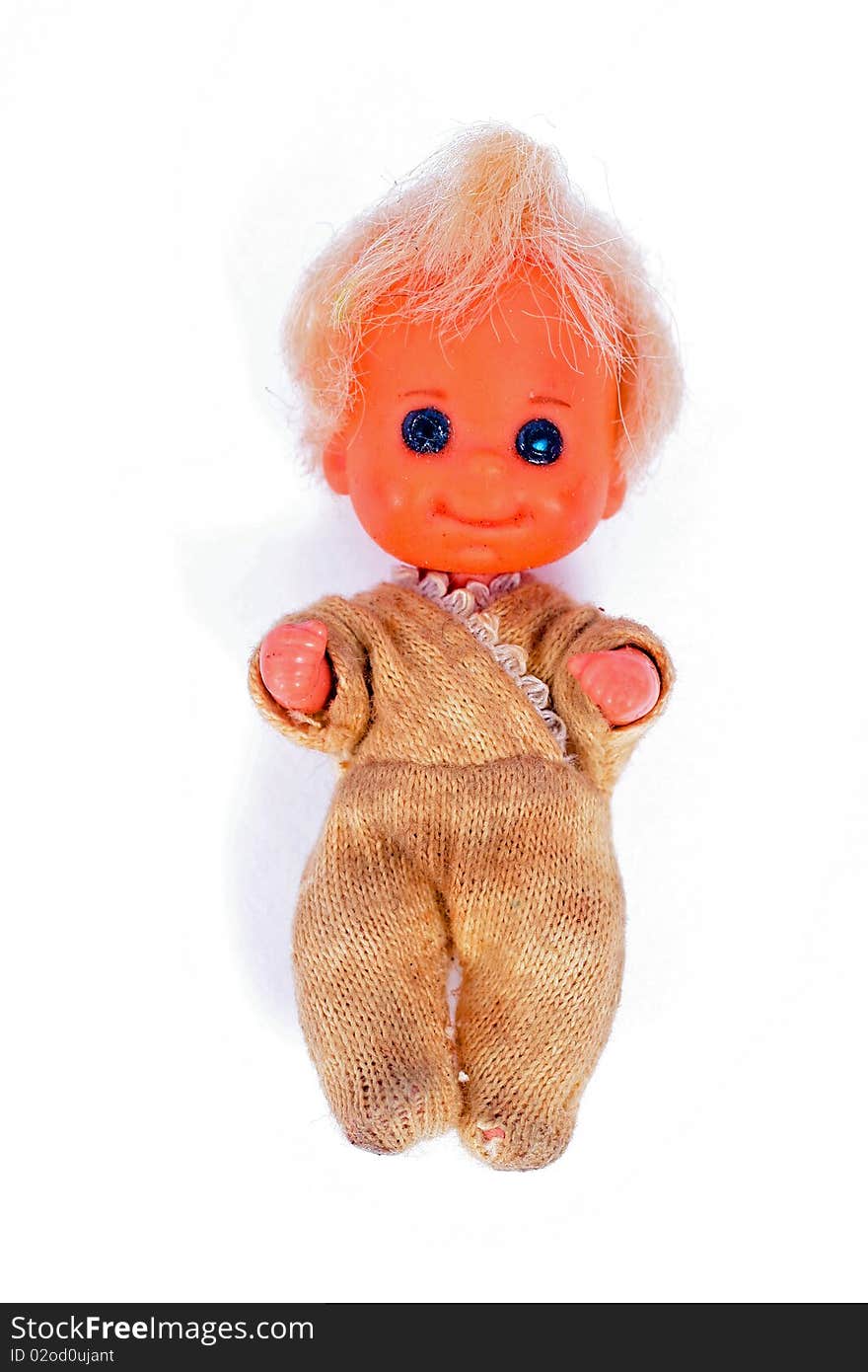 Vintage well-worn baby doll toy on white background. Vintage well-worn baby doll toy on white background