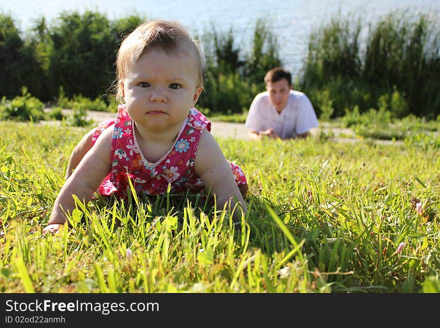 Child with his father at the lake