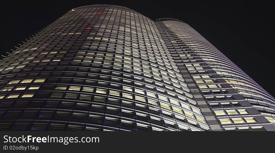 Small part of facade of skyscraper in Tokyo at night