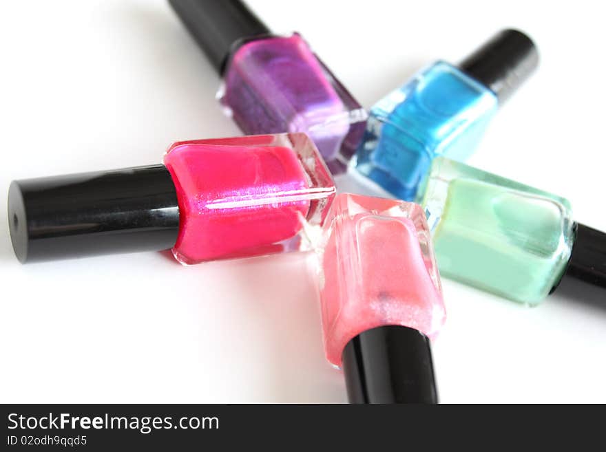 Close-up of colorful fingernail polish isolated on white background.