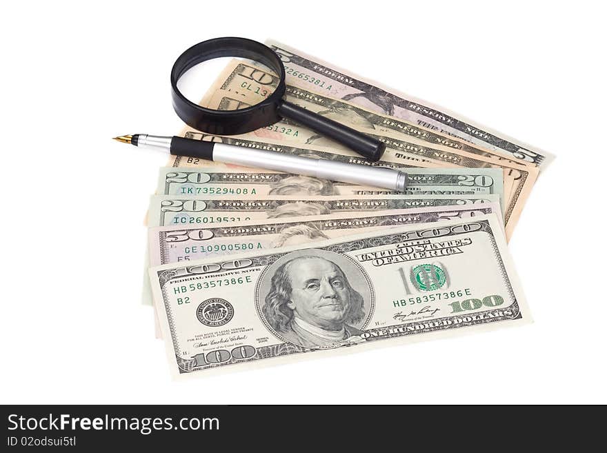 Magnifier and silver pen at dollar